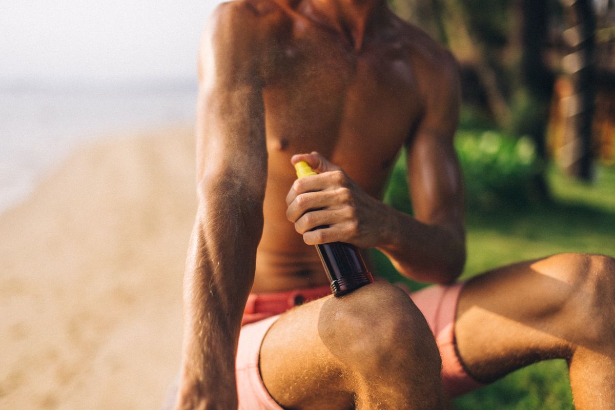 Spray tan application process using professional spray equipment